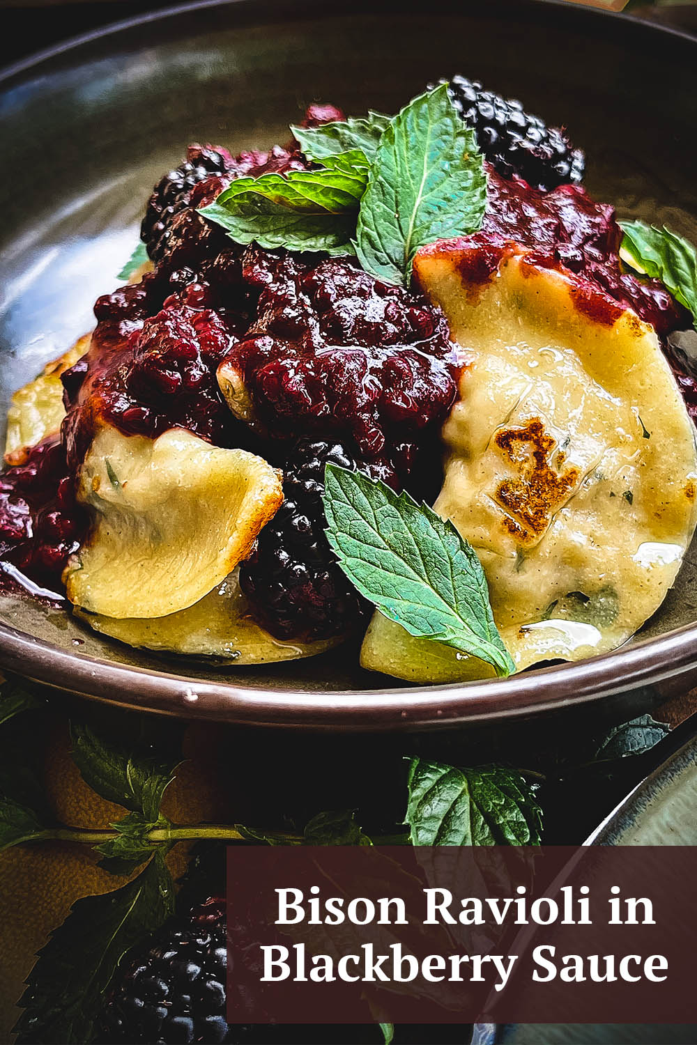 Handmade ravioli with mint, bison and blackberry sauce.